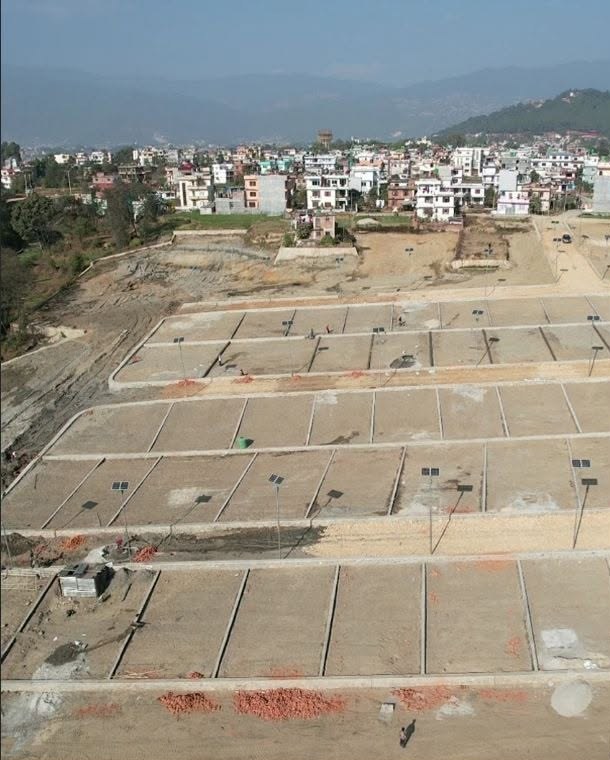 Aerial view of Deep Shree Developers plotted land with roads and street lights near Duwakot, Bhaktapur
